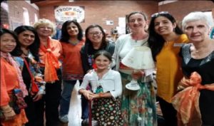 A group of people at a local hall fundraising