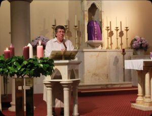 A woman speaking at church to the congretation
