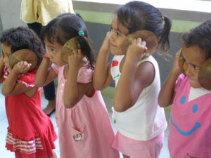 Children playing with musical instruments in class room